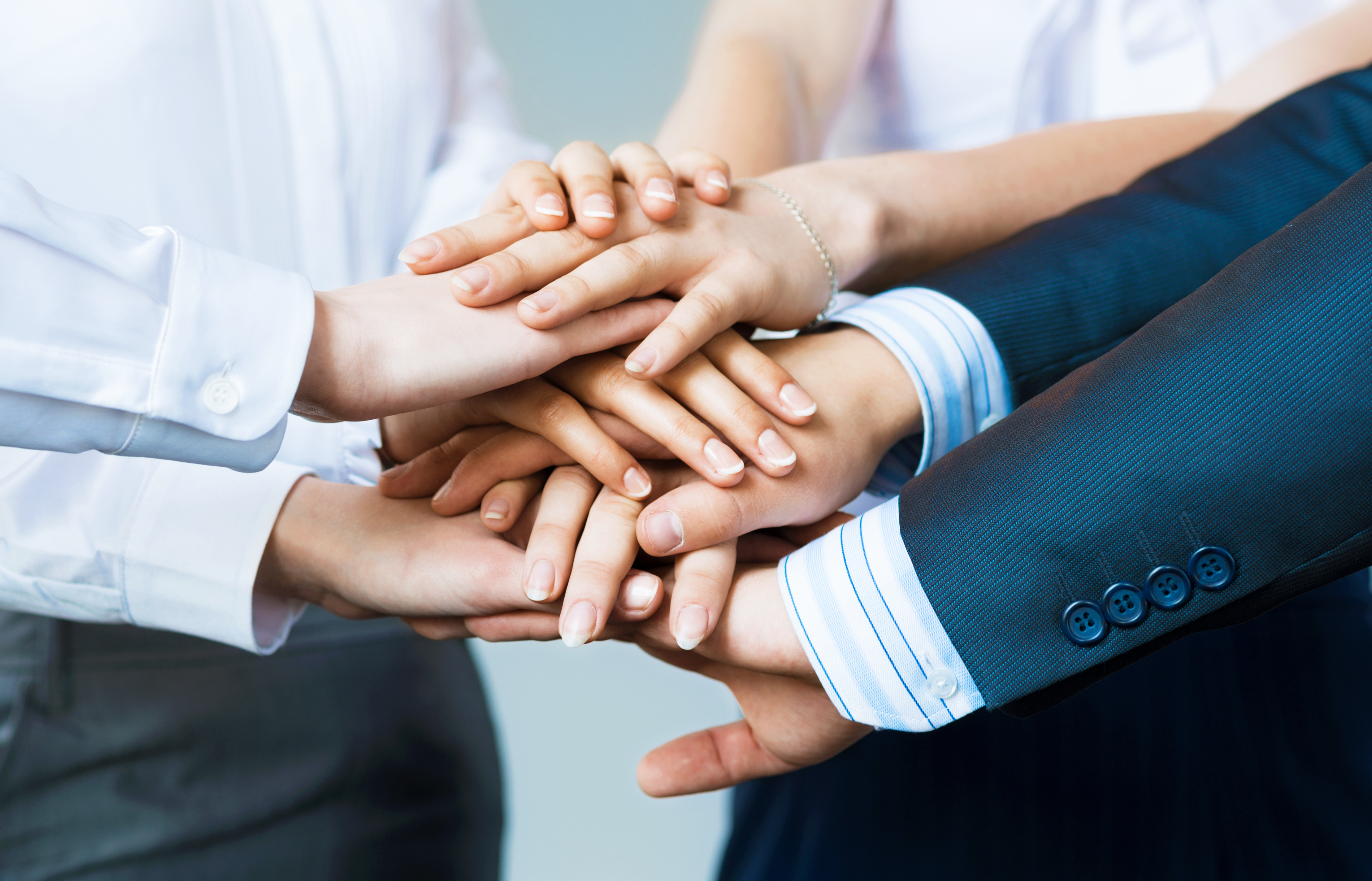 concept of teamwork. business people joined hands Medium